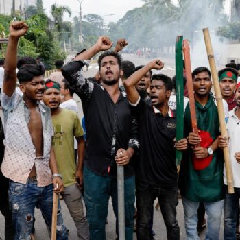 Demonstrators shout slogans after they have occupied a street in Dhaka. Pic: Reuters