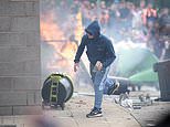 First country issues warning over travelling to the UK amid violent protests - as it urges citizens living in Britain to 'remain vigilant'