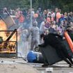 Britain on a knife-edge: Police forces across England mobilise 6,000 riot officers after THIRTY-EIGHT locations from Aldershot to Wigan were ear-marked for 'anti-immigration protests' TODAY in Telegram messages shared by racist far-right thugs