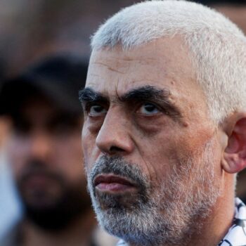 Hamas leader Yehya Al-Sinwar looks on as Hamas supporters take part in an anti-Israel rally over tension in Jerusalem's Al-Aqsa mosque, in Gaza City October 1, 2022. REUTERS/Mohammed Salem/