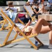 People out enjoying hot weather this month in Spitalfields, London. Pic: PA