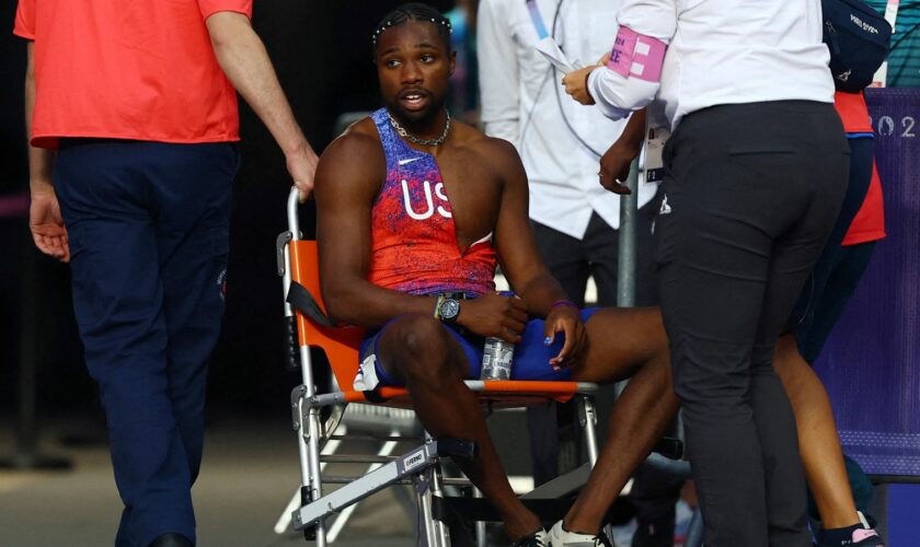 Noah Lyles receiving medical attention after the race. Pic: AP