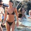 Kate Moss, 50, wows in a skimpy snake print two-piece as she lives it up with bikini-clad daughter Lila, 21, and pal Rita Ora, 33, in Formentera