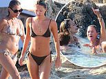 Kate Moss, 50, wows in a skimpy snake print two-piece as she lives it up with bikini-clad daughter Lila, 21, and pal Rita Ora, 33, in Formentera