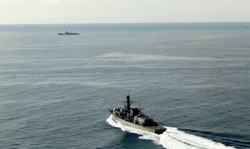 HMS Richmond (foreground) moves at speed to make contact with the Chinese destroyer Jiaozuo. Pic: Royal Navy