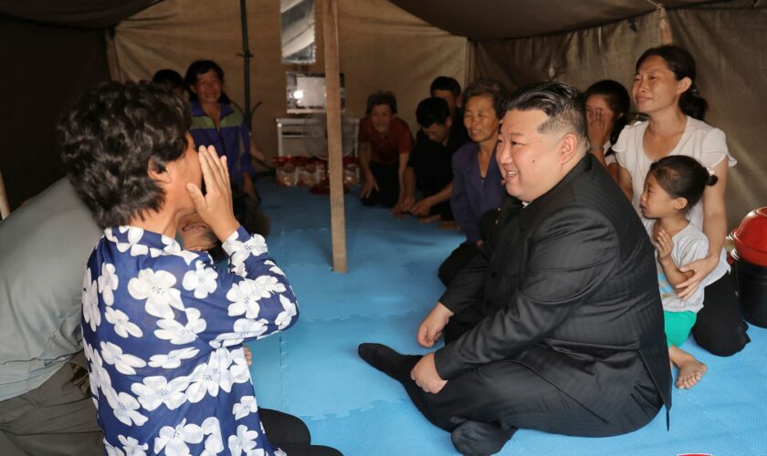 Kim visits a flood-hit area in Uiju. Pic: Korean Central News Agency/Korea News Service/AP