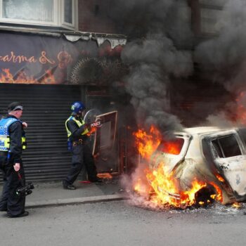 A car burns on Parliament Road, in Middlesbrough, during an anti-immigration protest. Picture date: Sunday August 4, 2024.