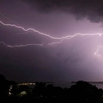 Lightning strikes over Poole harbour in Dorset as thunderstorms swept across parts of south west England after much of the country basked in sunshine and clear skies for the last few days.