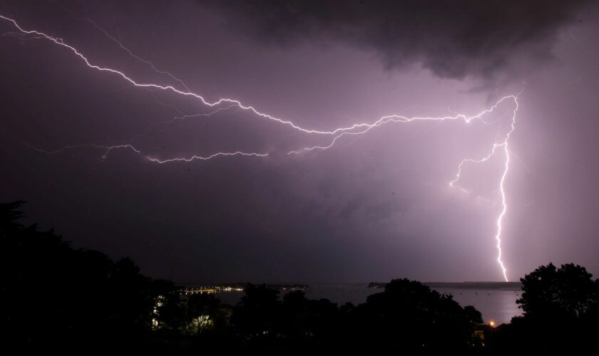 Lightning strikes over Poole harbour in Dorset as thunderstorms swept across parts of south west England after much of the country basked in sunshine and clear skies for the last few days.