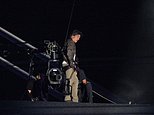 Hollywood legend Tom Cruise stands on the roof of Stade de France as he prepares for death-defying abseiling stunt to close the curtain on wacky Olympics closing ceremony