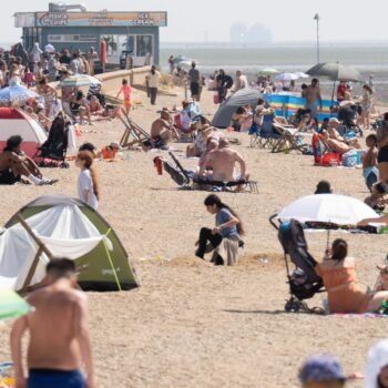 Beach goers enjoy the weather on what will likely be the warmest day of the year so far at Southend-on-Sea in Essex. Picture date: Monday August 12, 2024. Stefan Rousseau/PA Wire