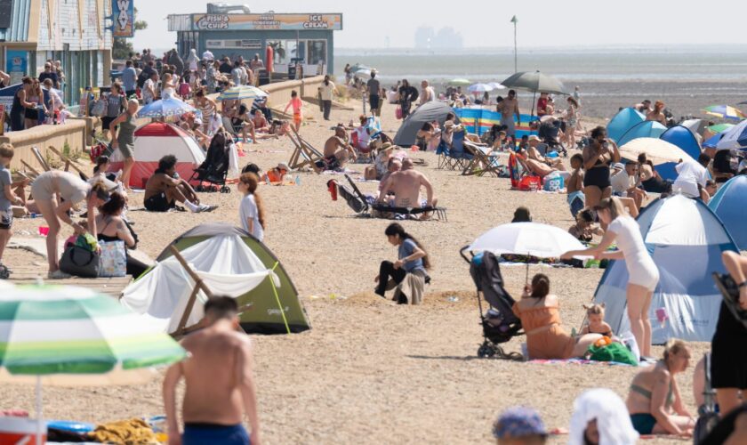 Beach goers enjoy the weather on what will likely be the warmest day of the year so far at Southend-on-Sea in Essex. Picture date: Monday August 12, 2024. Stefan Rousseau/PA Wire