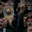 Hezbollah hold up portraits showing commander Fuad Shukr who was killed by an Israeli airstrike. Pic: AP