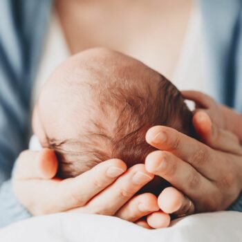 Newborn in mother's hands. Baby care. Childbirth and motherhood concept. Mother and baby. Pic: iStock