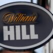 FILE PHOTO: Signage is seen outside a William Hill betting shop in Manchester, Britain March 28, 2023. REUTERS/Phil Noble/File Photo