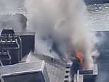 Fire rages at Somerset House as 20 fire engines carrying 125 firefighters struggle to quell blaze at iconic central London building