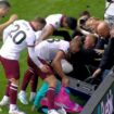 West Ham players rush to crying ball boy's aid after celebrating fans fall through advertising boards