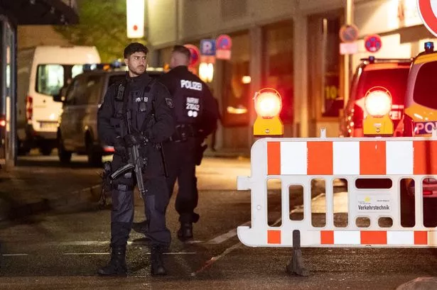 Solingen terror attack suspect, 26, hands himself into police and  says 'I am the one you are looking for'