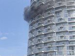 Second London tower block is ravaged by a blaze: Dozens of firefighters rush to tackle inferno at 45-storey high-rise - hours fire in nearby Dagenham flats sparked a major evacuation