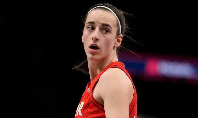 Fever's Caitlin Clark battles through tweaked ankle to tie WNBA rookie record in win over Dream