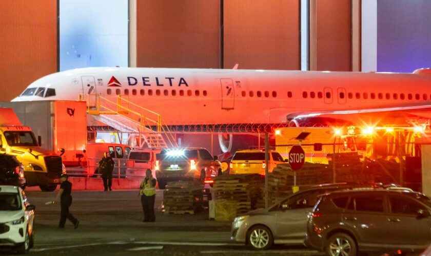 Multiple Atlanta Fire Rescue Department units and police park outside a Delta Maintenance facility near Hartsfield-Jackson International Airport early Tuesday, Aug. 27, 2024 in Atlanta. (John Spink/Atlanta Journal-Constitution via AP)