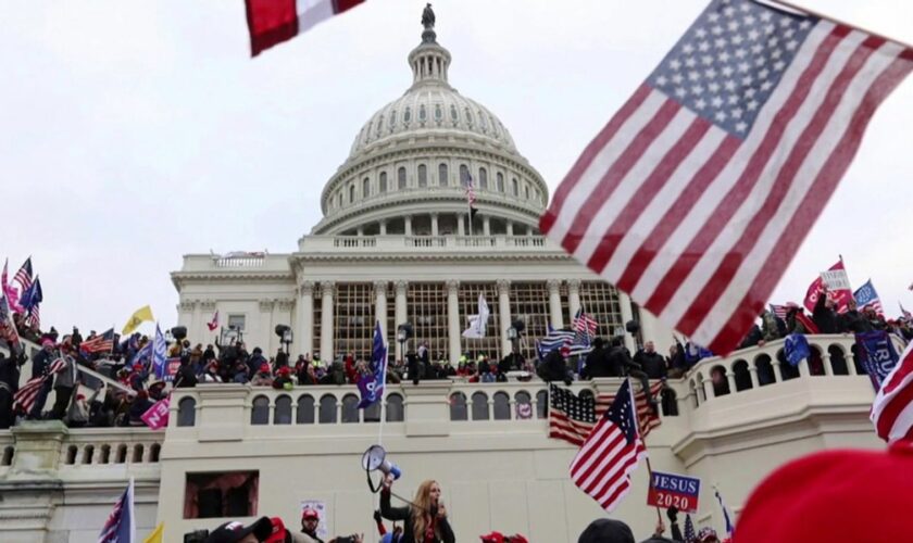 capitol with protesters in front