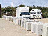 Travellers refuse to pay landowner to remove concrete bollards he used to block them into Isle of Wight car park - as stand-off enters second month