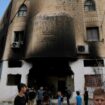 Palestinians outside a heavily damaged mosque in the West Bank. Pic: AP