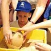 Pictured: The four-year-old boy who accidentally smashed priceless 3,500-year-old jar as he is invited back to see it being mended