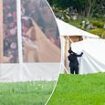 Princess Martha Louise of Norway and Shaman Durek finally tie the knot after months of anticipation - but the bride hides from cameras behind sheets on her way to the aisle