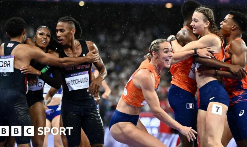 Great Britain and the Netherlands teams celebrate their respective mixed 4x400m relay medals