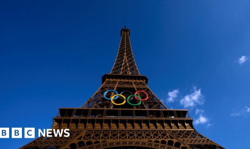 Man held for climbing Eiffel Tower on final Olympics day