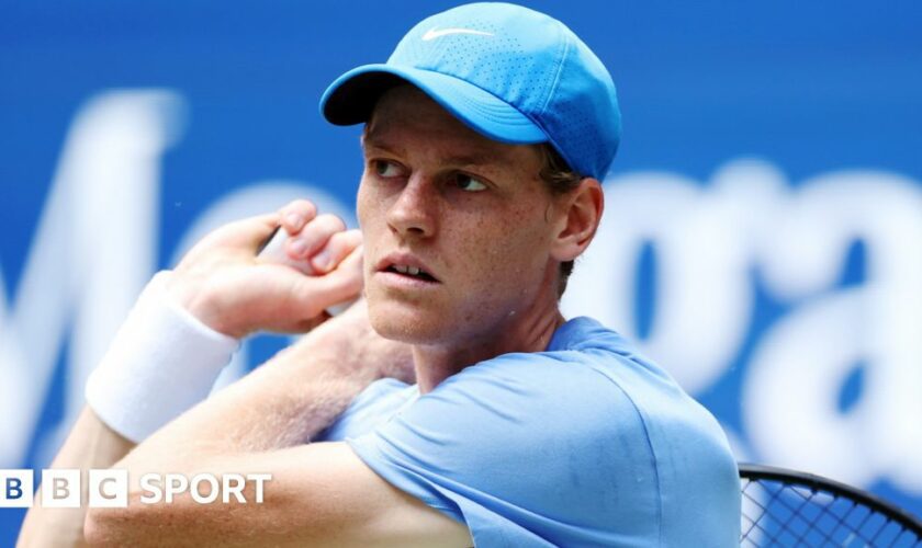 Jannik Sinner hits the ball at a practice session