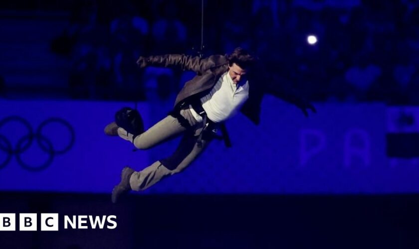 Tom Cruise abseils off stadium roof in daring Olympic finale