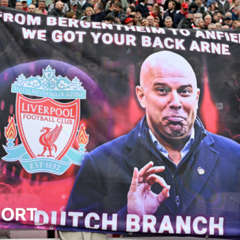 Liverpool fans hold up a banner before Arne Slot's first Premier League game at Anfield