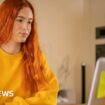 A student looking at her computer