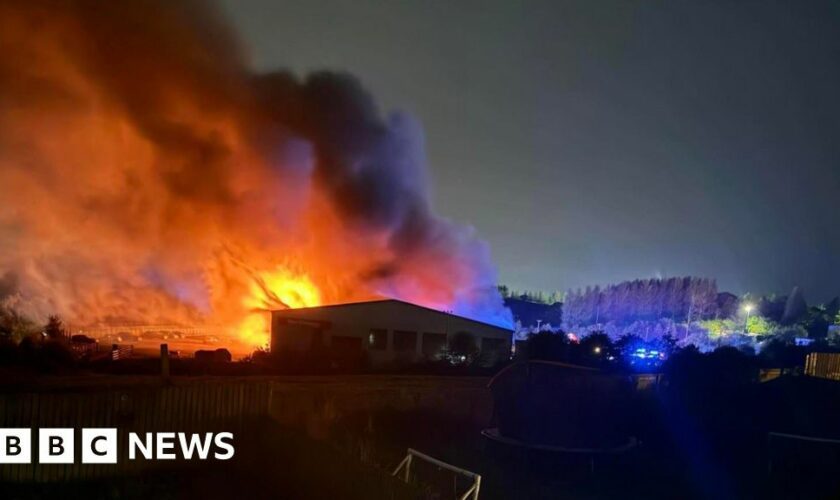 Windows 'shake' as large fire engulfs car dealership