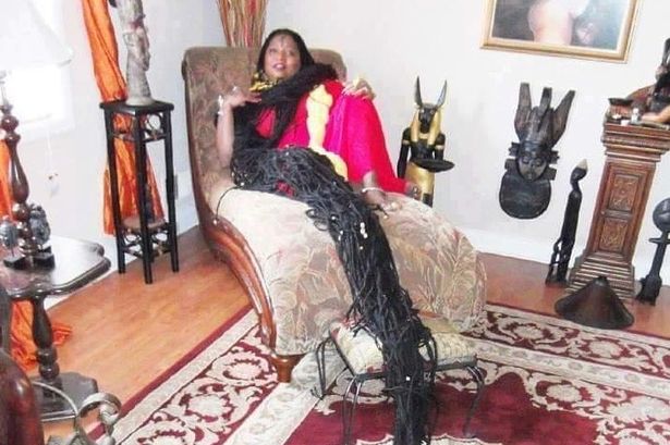 Woman cuddles 'world's longest dreadlocks' at night and hasn't had haircut in decades