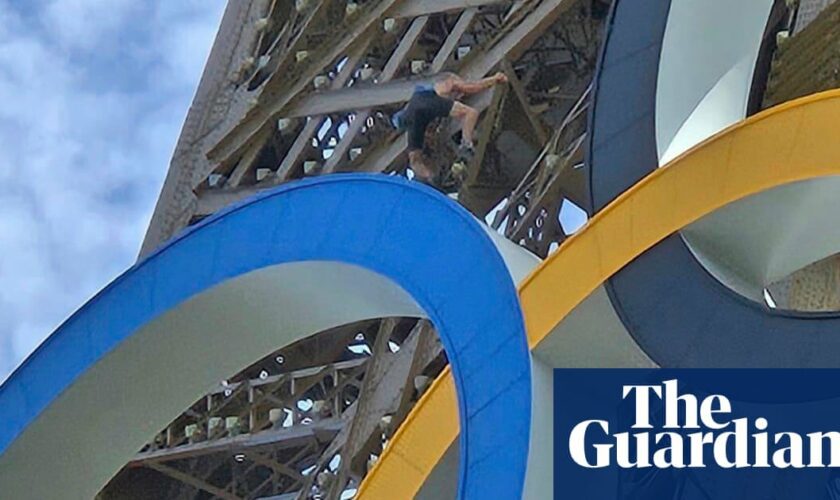 ‘Bloody warm, innit?’ says man scaling Eiffel Tower on last day of Olympics