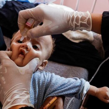 A Palestinian child is vaccinated against polio. Pic: Reuters