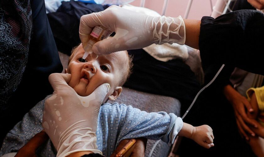 A Palestinian child is vaccinated against polio. Pic: Reuters