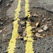 Council hits back after potholes painted with double yellow lines