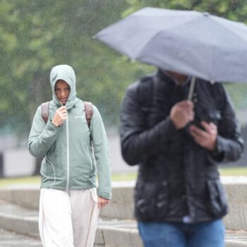 Britons caught in Storm Lilian this month during what was the coolest summer in years. Pic: PA