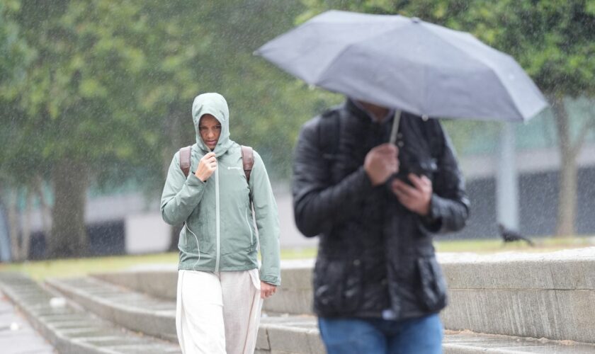 Britons caught in Storm Lilian this month during what was the coolest summer in years. Pic: PA