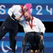 Nathan Macqueen and Jodie Grinham receive their gold. Pic: AP