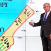 Israeli Prime Minister Benjamin Netanyahu stands before a map of the Gaza Strip, telling viewers how Hamas has imported arms into the territory since Israel's withdrawal in 2005, during a news conference in Jerusalem, September 2, 2024. Hebrew onscreen reads, "Gaza after the disengagement, oxygen pipe of Hamas". Ohad Zwigenberg/Pool via REUTERS