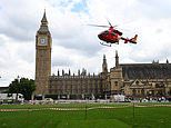 Woman cyclist is rushed to hospital after being hit by truck outside Houses of Parliament just moments after Keir Starmer entered for PMQs