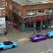 Lamborghini drivers park their supercars outside a Nando's and attract the attention of a traffic warden