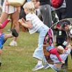 Not another royal sibling spat! Mike Tindall leaps into action to break up play fight between daughter Lena, 6, and son Lucas, 3, as family cheer on Zara at Burghley Horse Trials