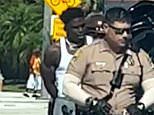 Tyreek Hill is HANDCUFFED by police on his way into Miami Dolphins stadium in astonishing scenes after being cited for 'reckless driving'